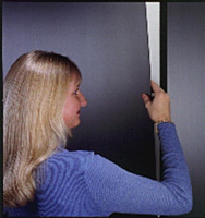 3M(TM) Reclosable Fastener- Picture of woman removing panel.